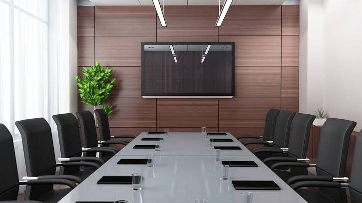 Private meeting room with timber table and alpine light at Wowwavehouse